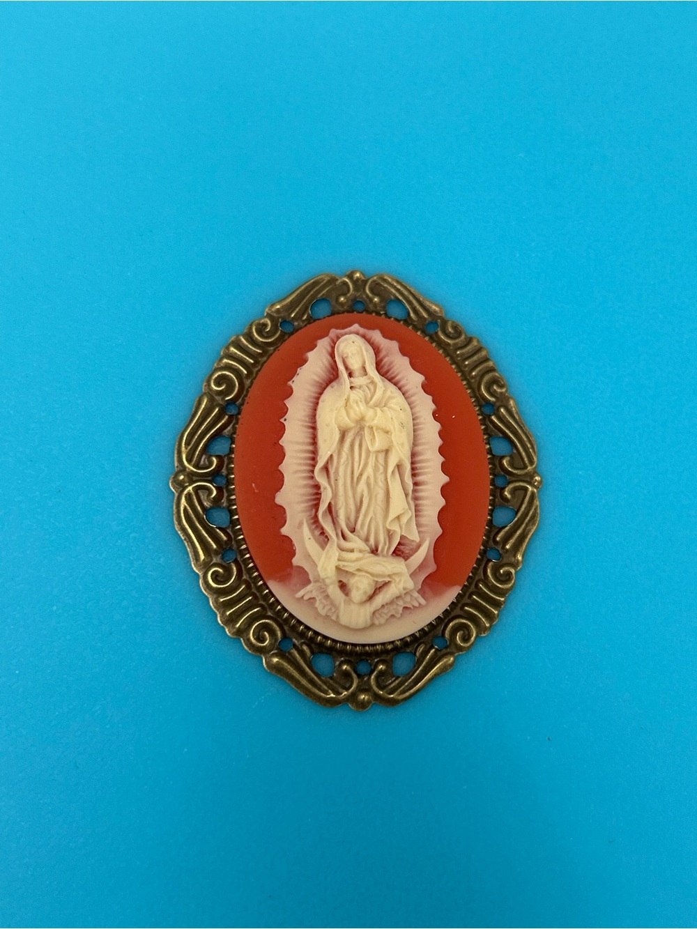 Virgin Mary Cameo Pendant Necklace in Coral and Cream with Gold-Tone Frame